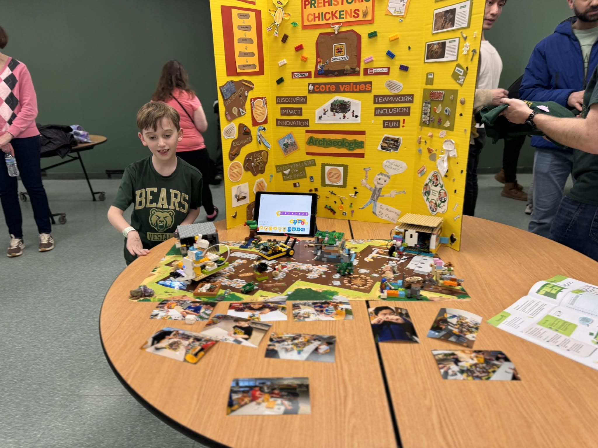 Student displaying LEGO model at Science Fair